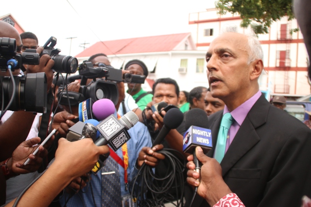 Communities Minister Ronald Bulkan speaking with the media