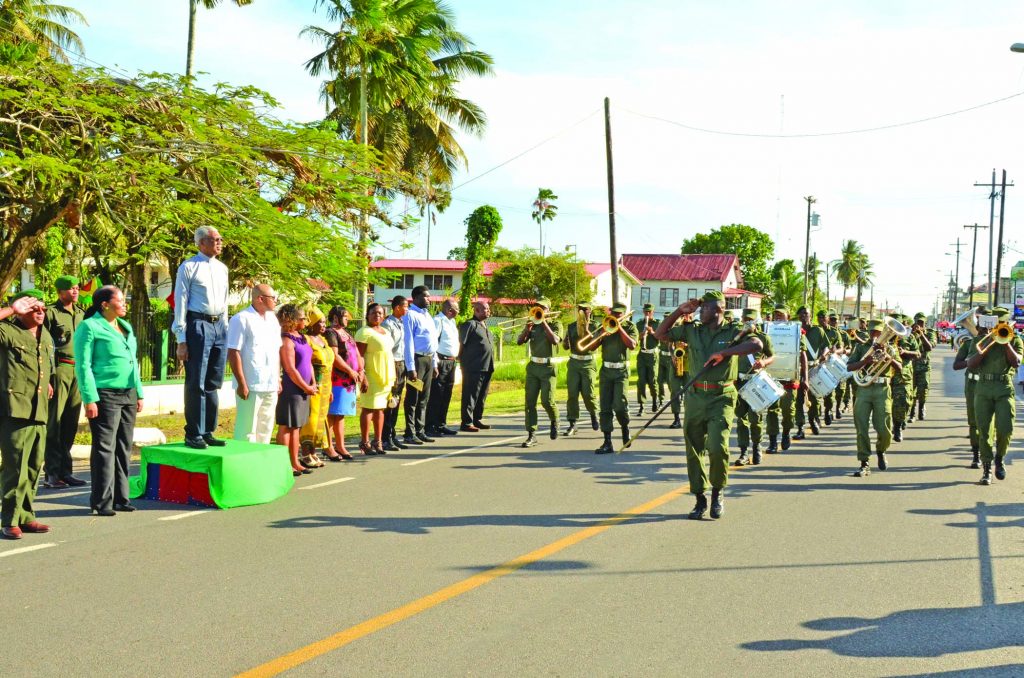 President David Granger taking the salute during the military parade in New Amsterdam as part of Town Week activities