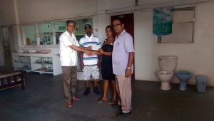 In picture, CEO Christopher Persaud (extreme left) presents the cheque while Hemraj and Rampersaud of David Persaud Investments look on