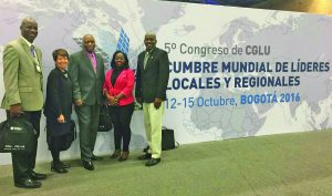 Deputy Mayor Arindell  (red jacket) along with other representatives from the Caribbean. From left: Mayor Scean Barnswell (Jamaica), CARILED Programme Director  Marion Villanueva, Alderman Anthony Roberts (Trinidad and Tobago) and Councillor Ralston Frazer (Belize) 