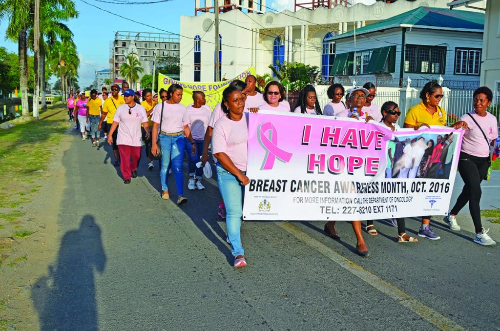 First Lady Sandra Granger and other marchers move apace along Church Street, Georgetown on Saturday 