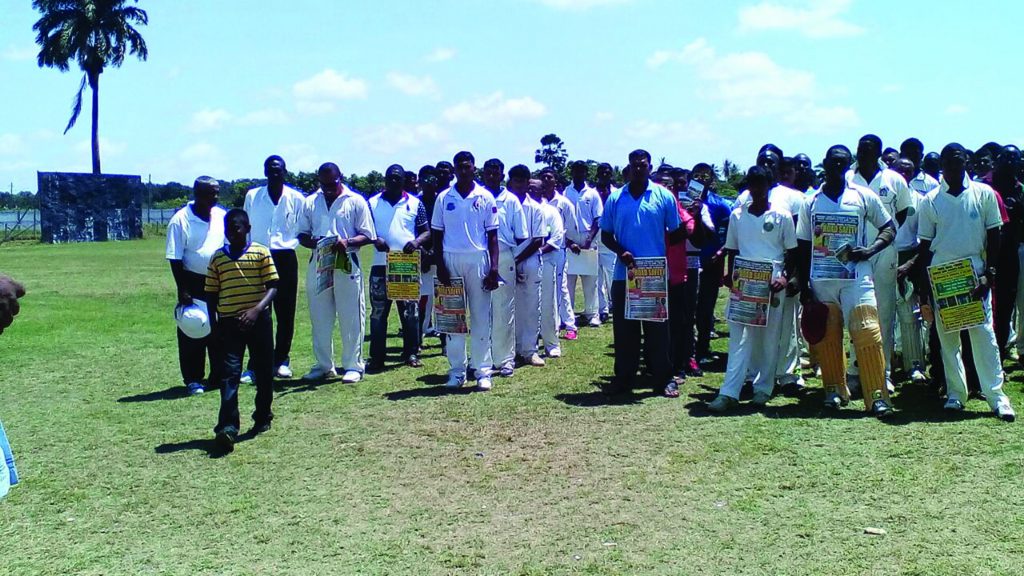 Teams participating in the tournament, posing with the Say No to Drugs booklet and posters 