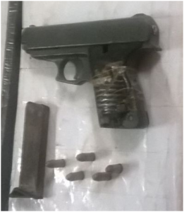 The illegal firearm with ammunition found in the possession of the robbery suspect