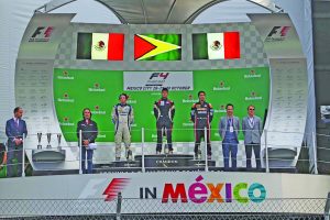 Golden Arrow head moment!  Calvin stands at the top of  the podium as   Guyana National anthem is played at the Mexican stadium