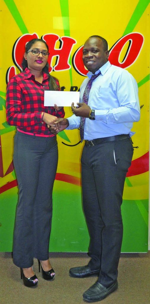 UG Nursing Society President Garfield Bryan receiving the cheque from NEW GPC INC Marketing and International Sales Associate Elisabeth Ram 