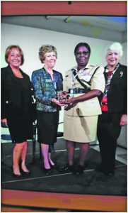 Senior Superintendent Maxine Graham receiving her Award from Madam President of IAWP, Margaret Shorter, in Barcelona in the presence of other officials from the Association  