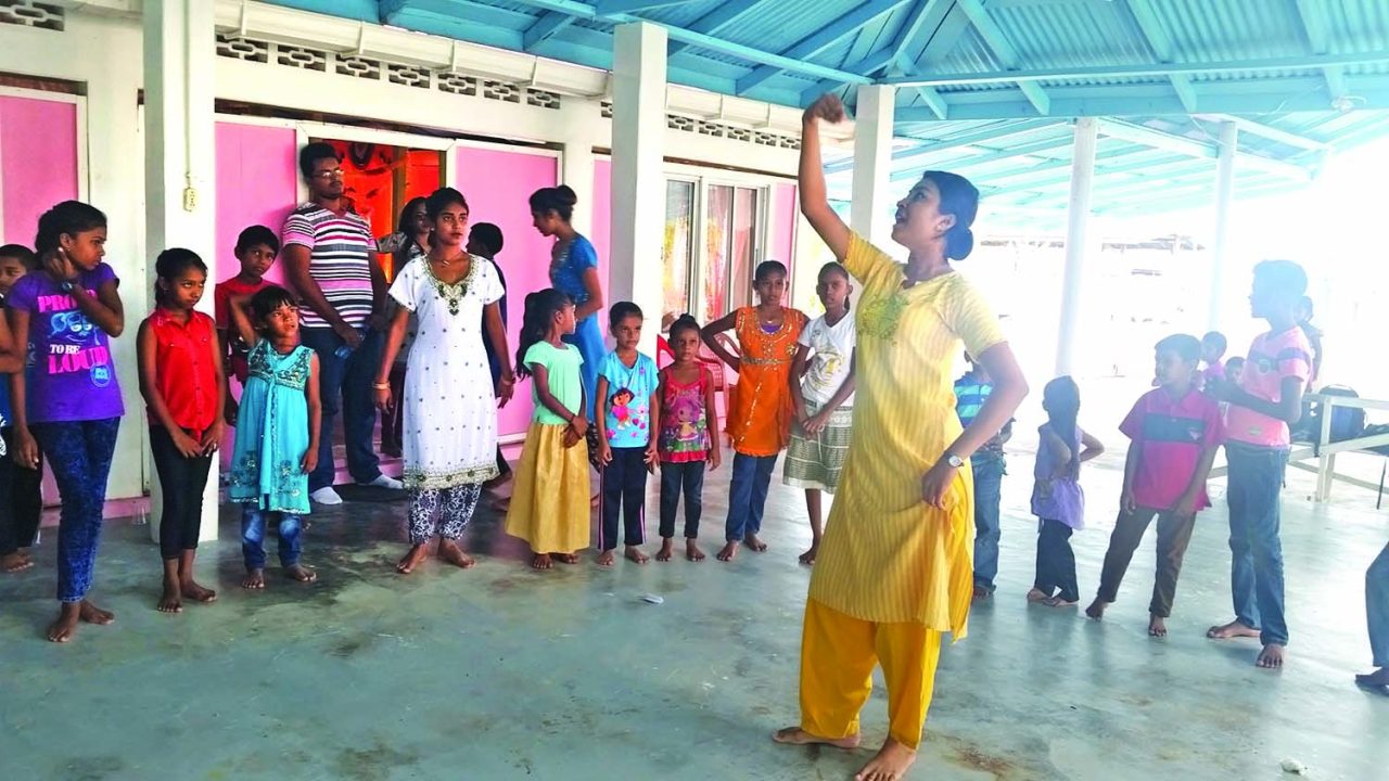 Dance teacher Sursattie Singh with the children at the camp 