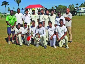 Champions! Chase Academy pose with their championship trophy at Bourda