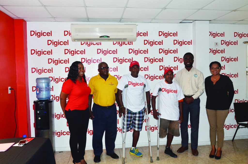 Digicel Events and Sponsorship Manager Louiana Abrams (far left)  Special Olympic Association member  Wilton Spencer (second from left), Assistant Director of Sport Brian Smith (second from right ) Digicel’s Communication Manager Vidya Sanichara  (right) along with two amputees at the event launching on Thursday 