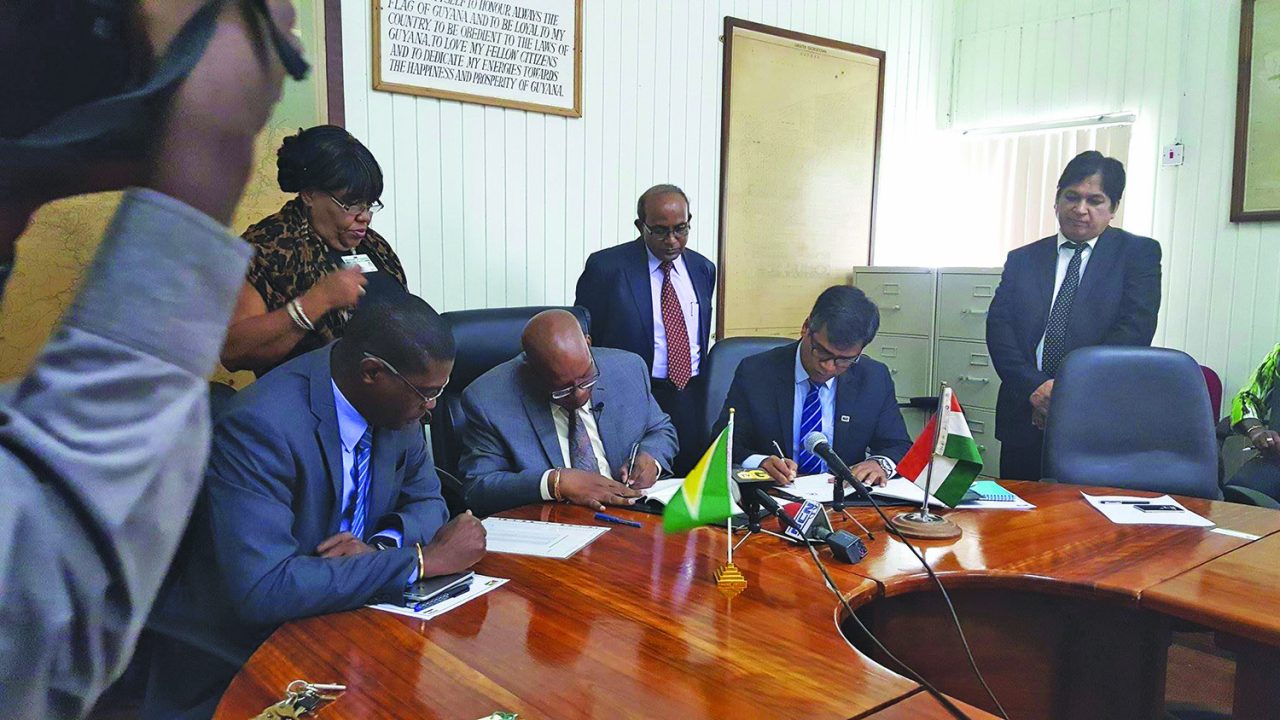 Finance Minister Winston Jordan and India Export-Import (EXIM) Bank resident representative Sailesh Prasad sign the 20-year agreement 
