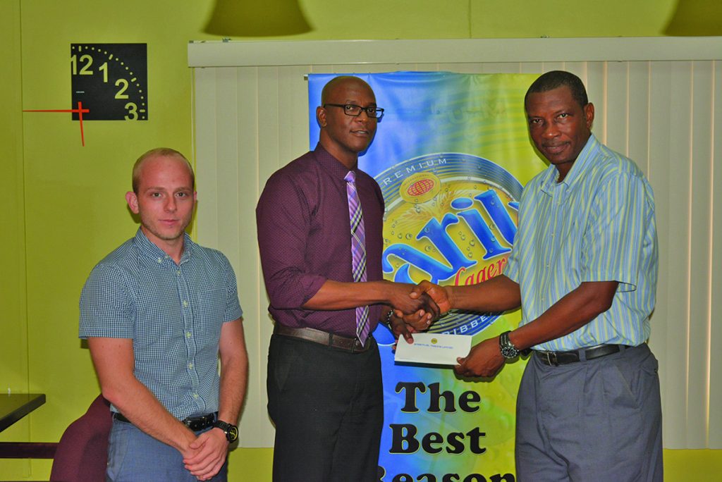GCA/ Carib beer T20 launched! President of GCA, Roger Harper receives the sponsorship cheque from ANSA McAL Trading LTD, Human Resource manager, Sheldon Hazelwood in the presence of Marketing Manager of the company, Robert Hiscock 