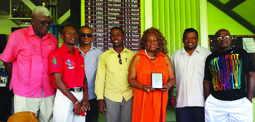 Ira 'Lady Ira' Lewis (third right) with members of the Guyana Committee of Services. From left are Eugene Noel, Young Bill Rogers, Joseph Ramkumar, boxer Clive Atwell, Rajan Tiwari and Leslie Black