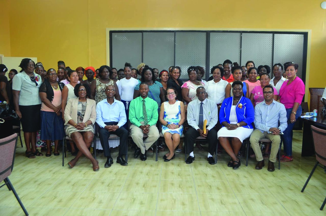 First Lady Sandra Granger (centre) is flanked by (from left, seated) Lieutenant Colonel (ret’d) Yvonne Smith of the Office of the First Lady, Wayne Barrow facilitator at Interweave Solutions Incorporated, Region Ten Mayor Carwyn Holland, Regional Chairman Renis Morian, Sandra Adams, Assistant National Director of Community Development Council and Yohann Pooran, facilitator at Interweave. The participants are pictured standing