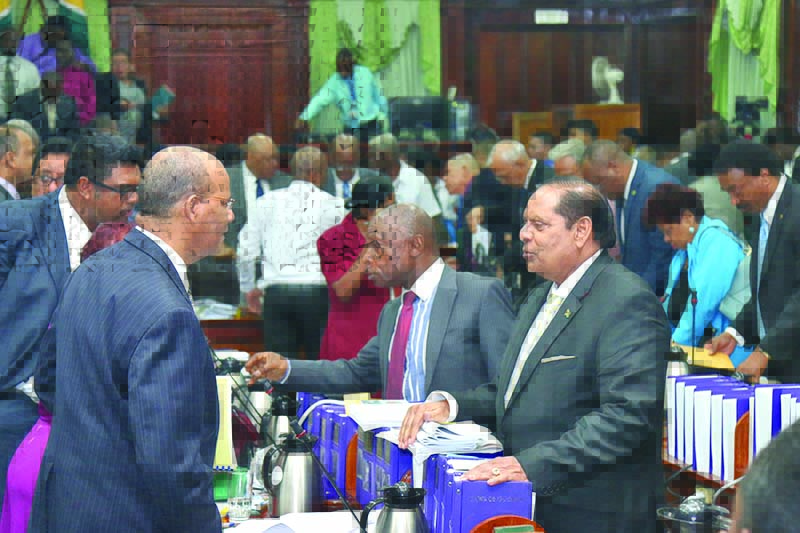 Clement Rohee interacting with Prime Minister Moses Nagamootoo after the Budget Presentation 