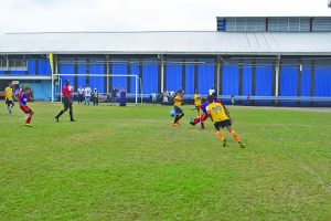 Part of the action in the St Agnes (red) and Marian Academy encounter at the Banks DIH Thirst Park ground