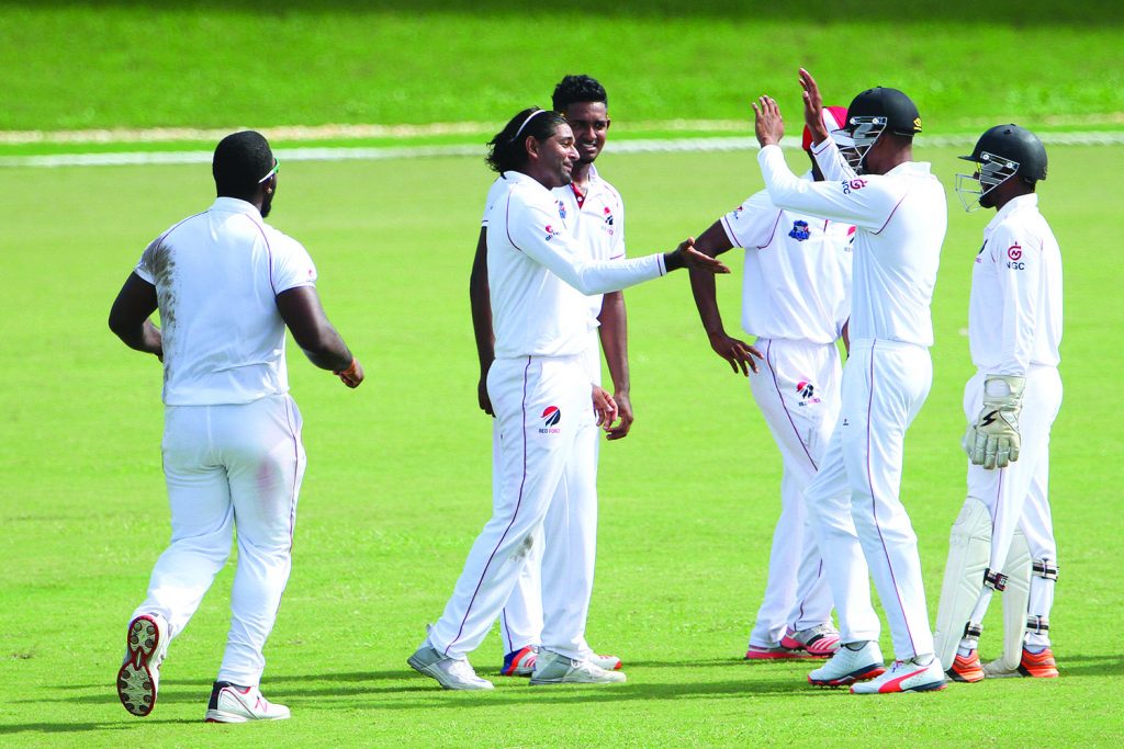Imran Khan is congratulated after picking up three wickets for the hosts 