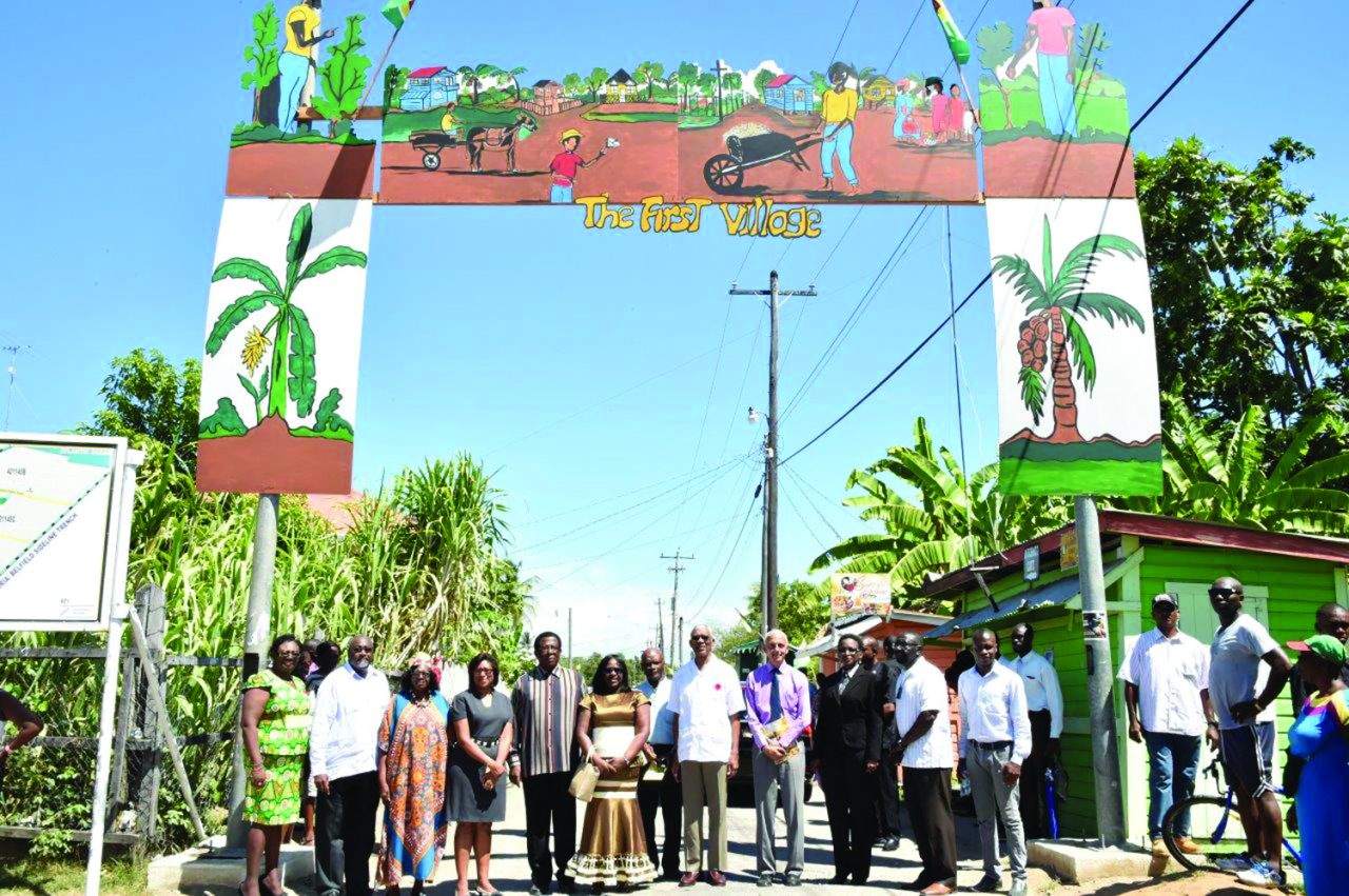 President David Granger (centre), Government Ministers, regional officers and village officials at the "First Village' Arch, which has been designed and mounted by the villagers 