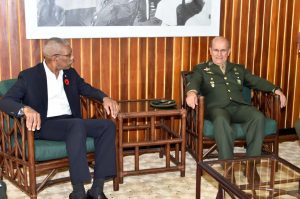 President David Granger engaging the Military Commander of the North of the Brazilian Armed Forces, General Carlos Alberto Neiva Barcellos, during their meeting at the Ministry of the Presidency