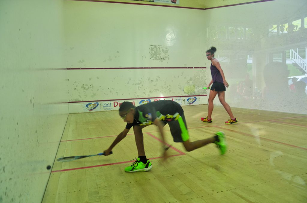 Missed it! An outstretched Shomari Wiltshire fails to get his racket on the ball during his   intense  match with Taylor Fernades  