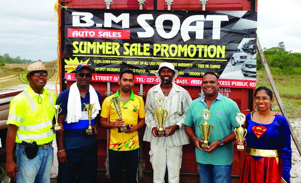 1st Place Winners Ryan McKinnon (centre right) & Jagmohan Bassoo (center left) pose with other prize winners 