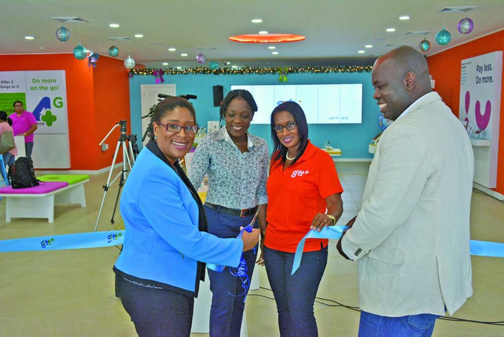 GTT’s CEO Justin Nedd and Telecommunications Minister Cathy Hughes cut the ribbon to offically launch the new Customer Experience Store in the presence of GTT Head of Marketing Allison Dundas at the 55 Brickdam location on Friday