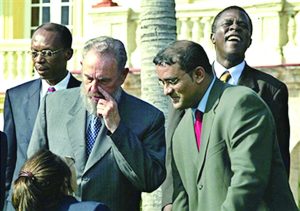 Cuban President Fidel Castro (L-Front) is seen with former President of Guyana Bharrat Jagdeo (R-Front), along with Haitian President Jean-Bertrand Aristide (back left) during ceremonies in La Habana, Cuba in December 2002