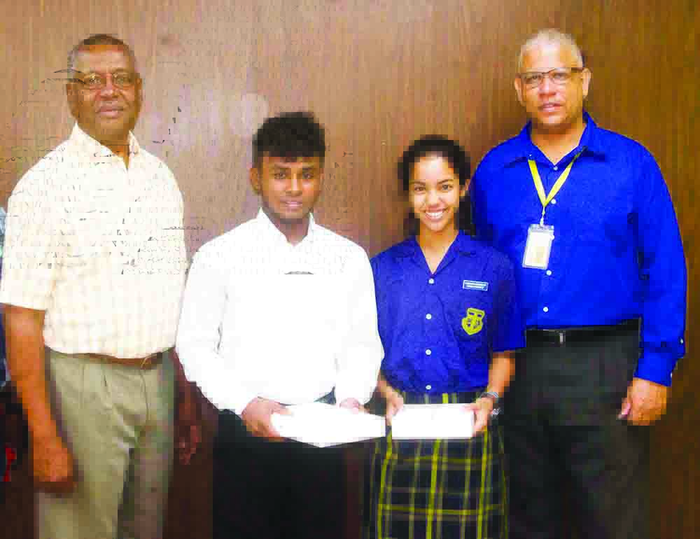 Banks DIH Limited newest Sport Brand Ambassadors Kemo Cornelius (2nd from left) and Rebecca Low pose off with the company’s Co-Managing Director/Marketing Director George McDonald (left) and Sales Executive Carlton Joao