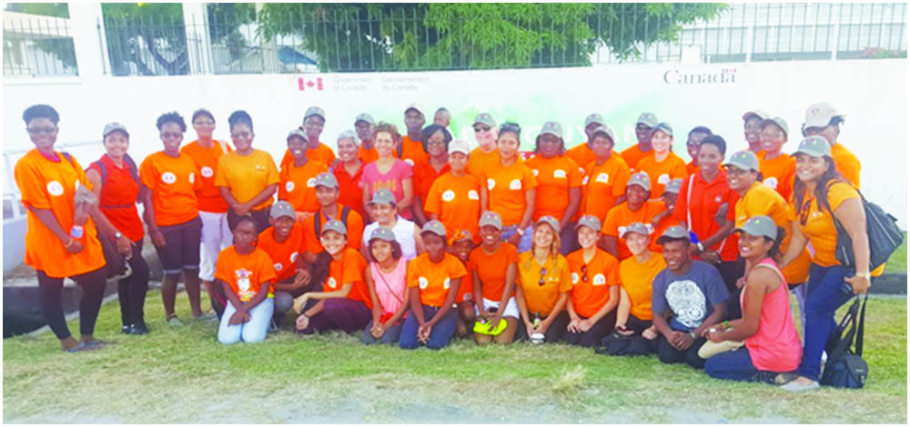 #OrangetheWorld: Participants  in the Canadian High Commission’s 16 Days of Activism Against Gender-Based Violence activities at the diplomatic  headquarters before heading over to the seawall on Saturday  