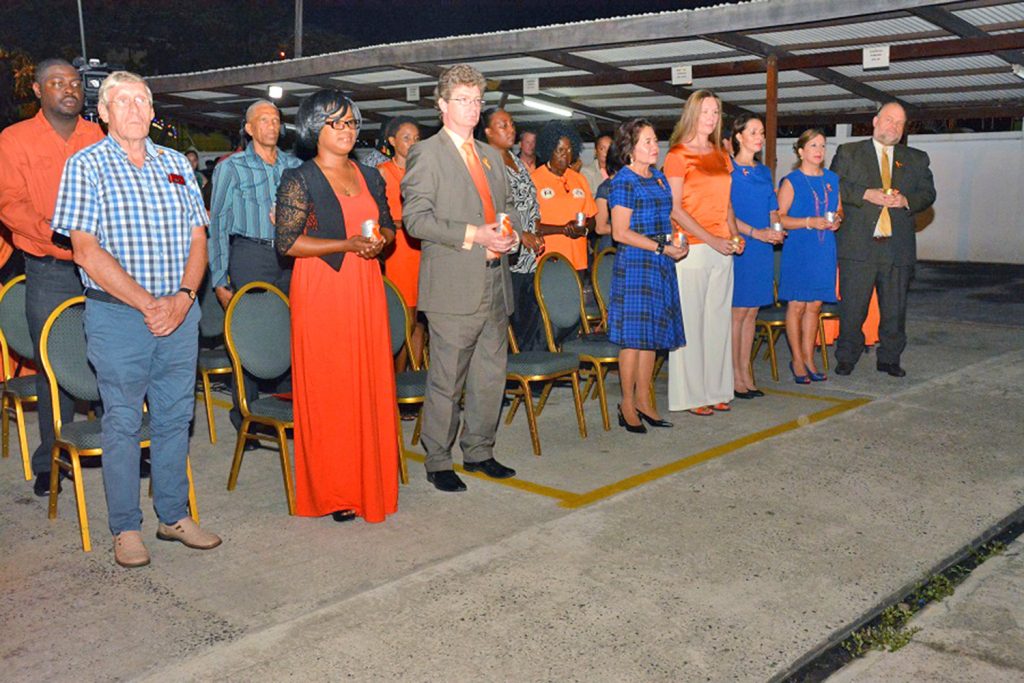 Social Protection Ministry Sexual Offences and Domestic Violence Policy Unit Manager Akeela Doris (second left); British High Commissioner Greg Quinn; First Lady Sandra Granger; Mrs Ruta Drizyte-Videtič, the wife of the European Union Ambassador to Guyana, US Ambassador Perry Holloway and other attendees in a moment of silence for lives lost due to Gender-Based Violence 