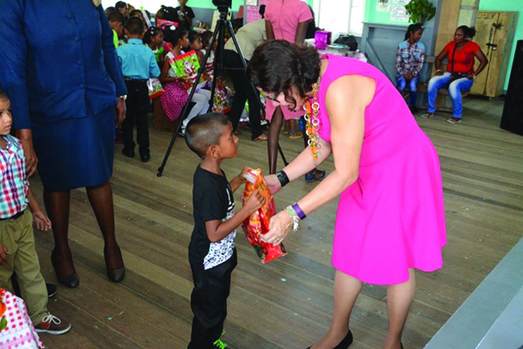 This little boy was happy to receive his present from First Lady Sandra Granger