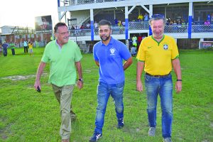 From left to right-Argentine Ambassador to Guyana HE Luis Alberto Martino, GFC General Manager Faisul Khan and Brazilian Ambassador to Guyana HE Lineu Pupo de Paula walk on to the field before the Chapecoense memorial match commenced  