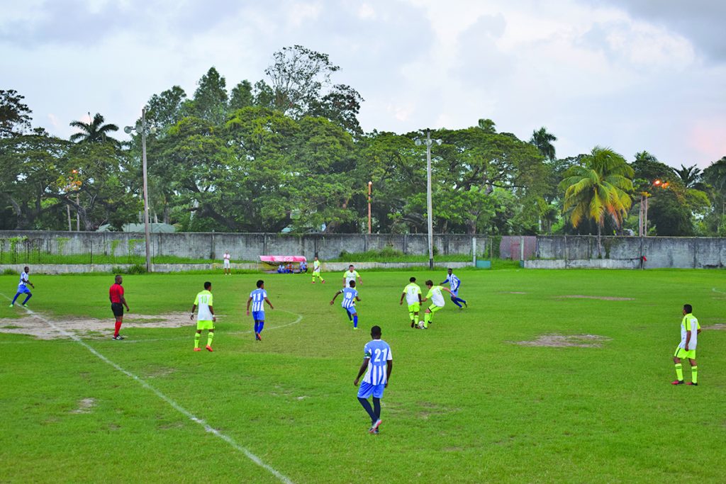 Part of the intense action between the Brazilian select squad (yellow)  and Georgetown Football Club  on Saturday  