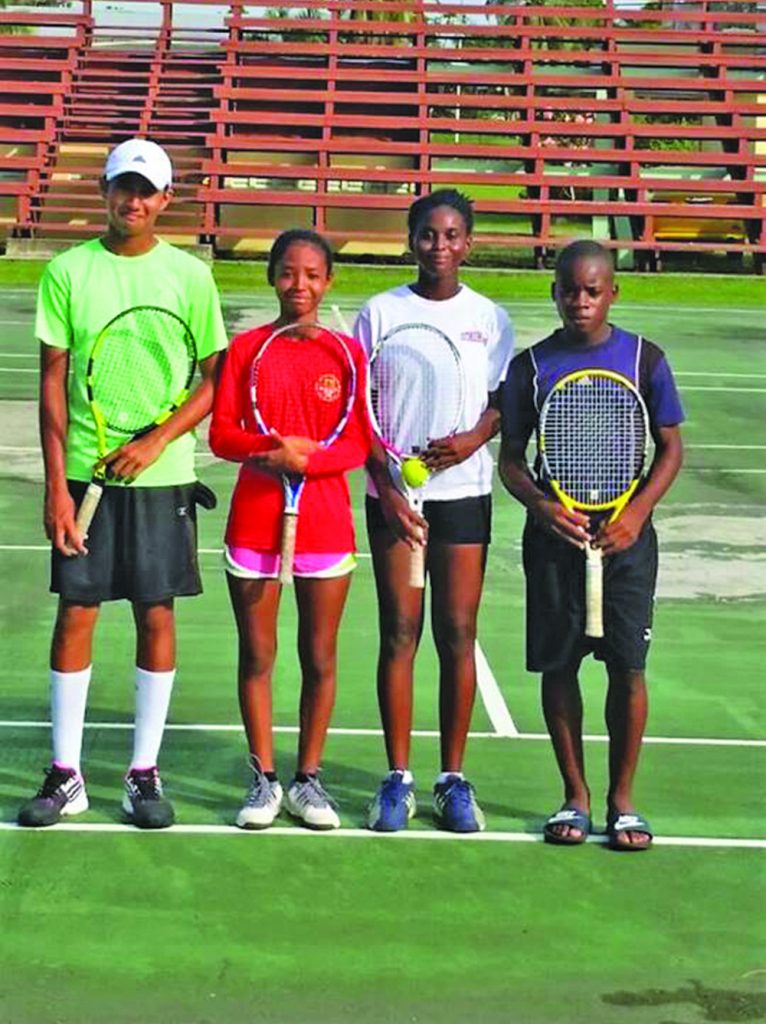 Heimraj Resaul and Kalyca Fraser first two from left pose with Nicola Ramdyhan and Mark McDonald after their semifinal mixed doubles bout on Monday