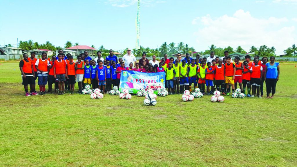 All participants pose for a group photo with GFF Technical Director, Ian Greenwood, coaches and parents at the Scottsburg Ground on Saturday