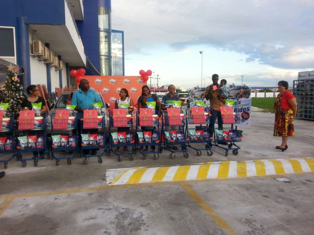 The participants standing in front of their shopping carts