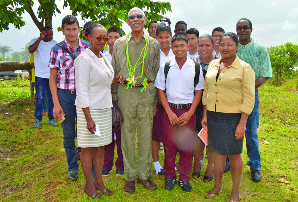 President David Granger (second from left) and acting Headmistress Carlotta Joseph (left) with some students of the North West Secondary School, and regional officials