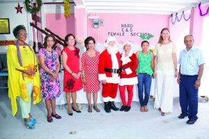 First Lady Sandra Granger (third from left) is flanked by Pamela and Kella Ramsaroop at the Dharm Shala’s Christmas party for children. Executive of the Board of the Dharm Shala, Edward Boyer and Ruta Drizyte-Videtič, wife of the European Union Ambassador to Guyana, are pictured first and second from right