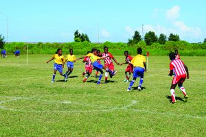 Players from West Ruimveldt Primary and North Georgetown Primary in an gripping contest at the Ministry of Education ground, Carifesta Avenue on yesterday  