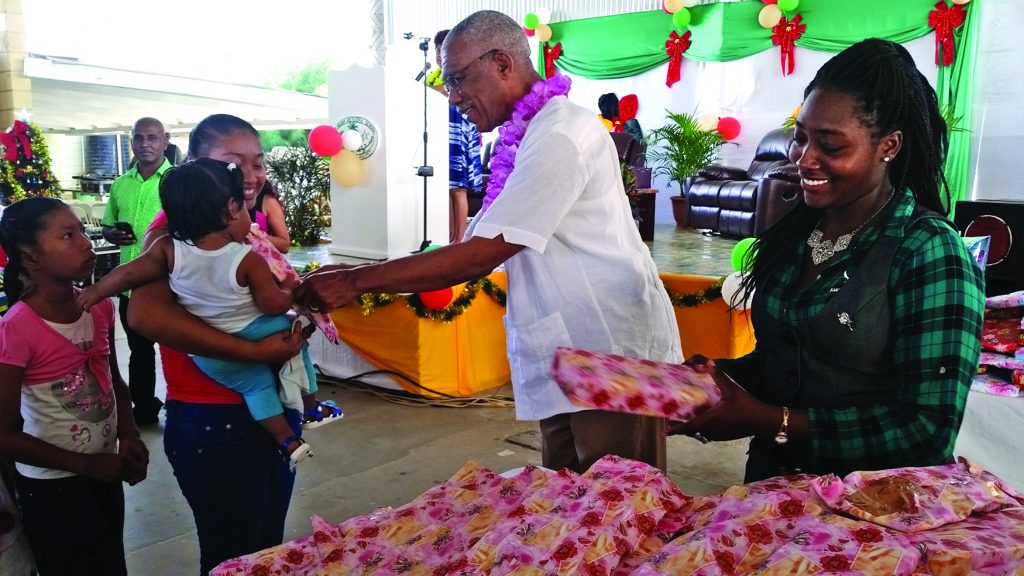 President David Granger distributing gifts