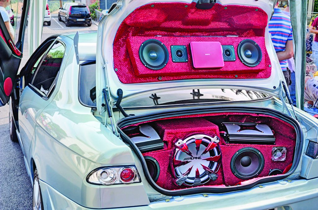 BORGHI,RN, ITALY - AUGUST 12: power music audio system with amplifiers bass and treble speakers in the car trunk, exhibited during the rally "Fashion tuning club" on August 12 2012 in Borghi RN Italy