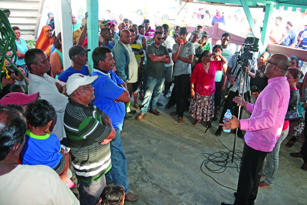 Opposition Leader, Bharrat Jagdeo meeting with residents of Patentia, Wales, West Bank Demerara (WBD) on Wednesday as they vented their fears and concerns about the imminent closure of the Wales Sugar Estate factory (Marceano Narine photo) 