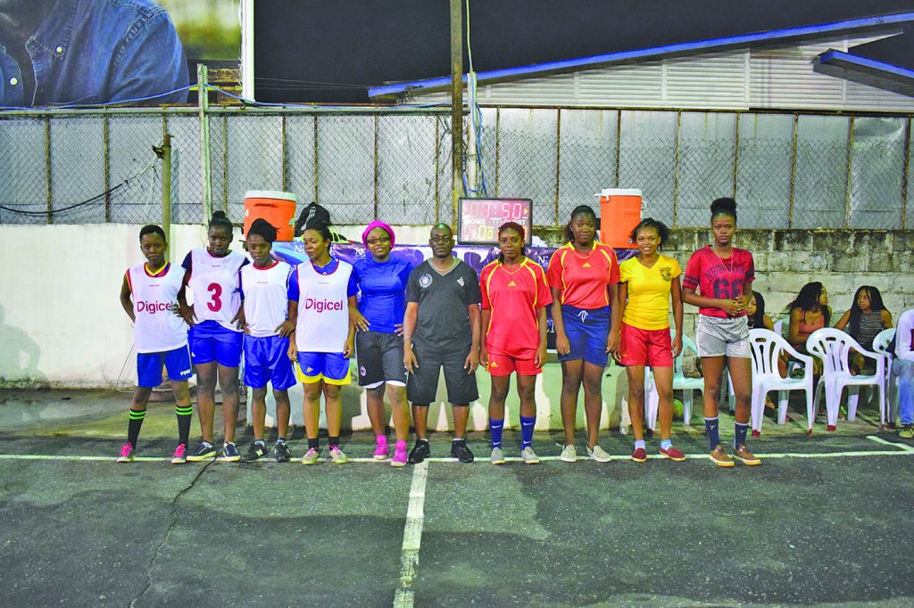 The ladies of Demerara Queens with Collin Aaron (Center) 