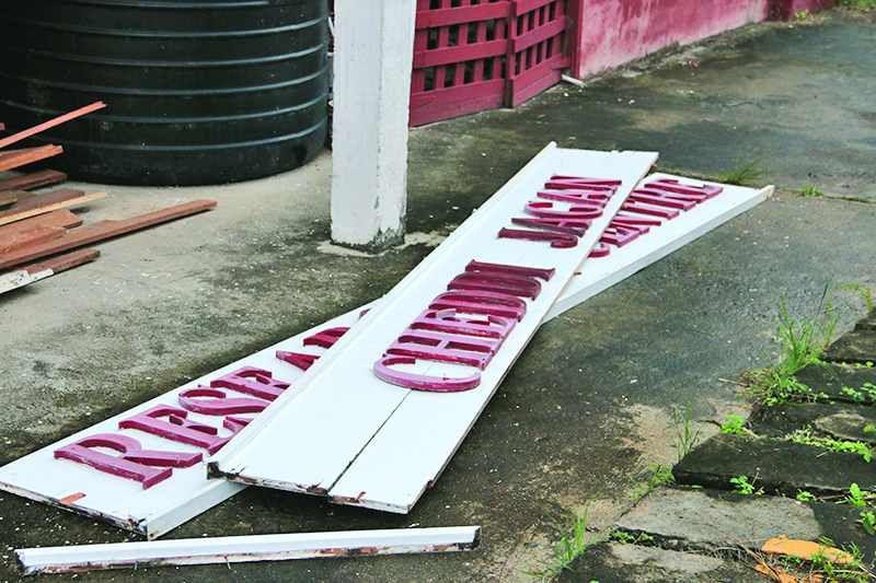 The Red House sign that was ripped down by Government officers  
