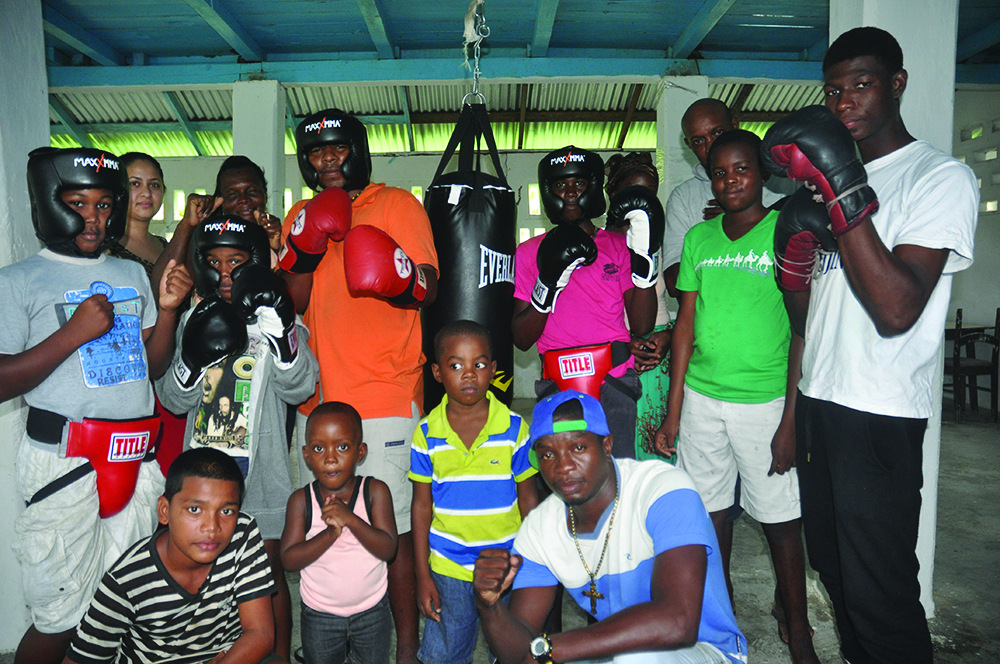 Revlon Lake (extreme right in front row) with happy members of the Wakenaam Boxing Gym