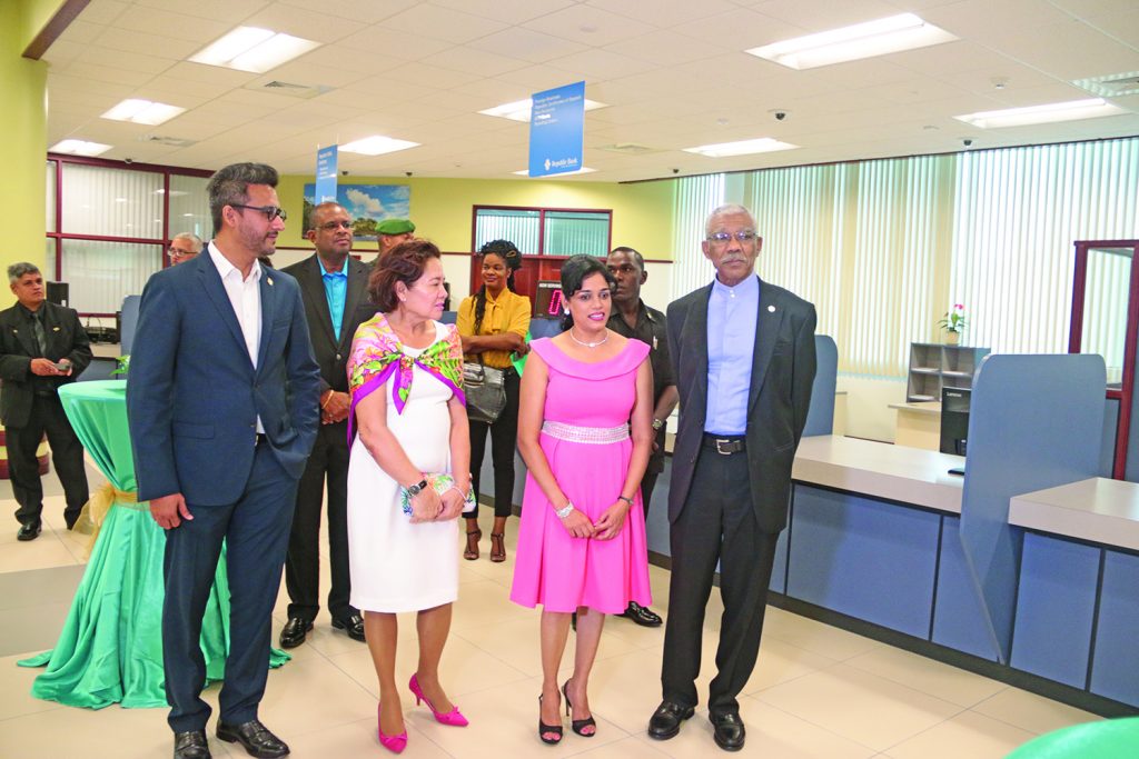 The President and First Lady on a tour of the new facilities at the Republic Bank, Triumph branch