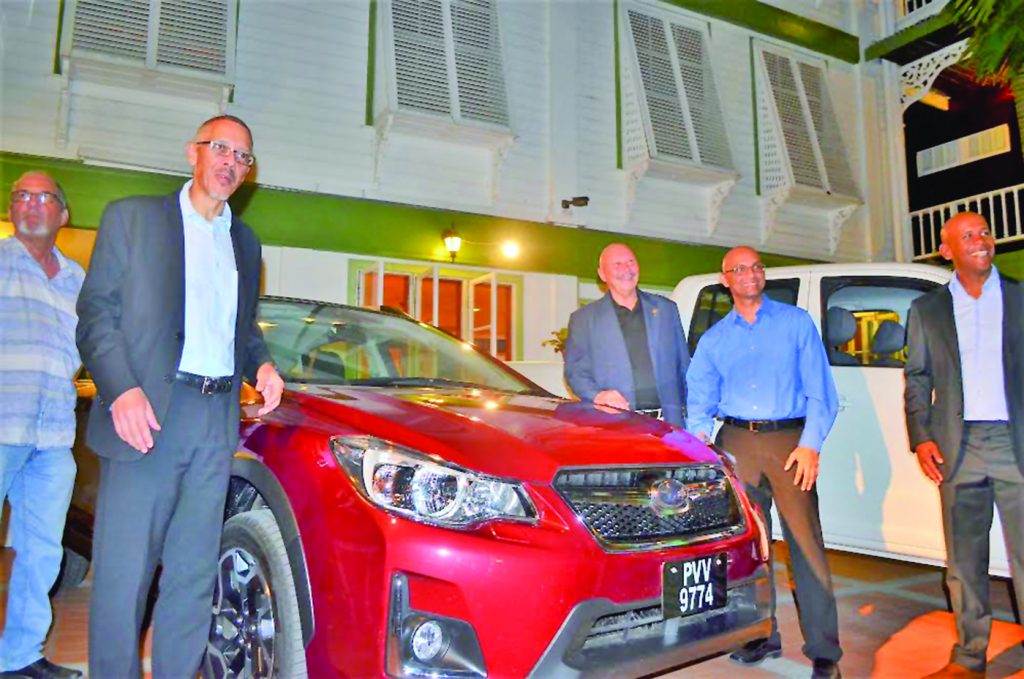 Business Minister Dominic Gaskin inspecting one of the vehicles at the launch on Friday  