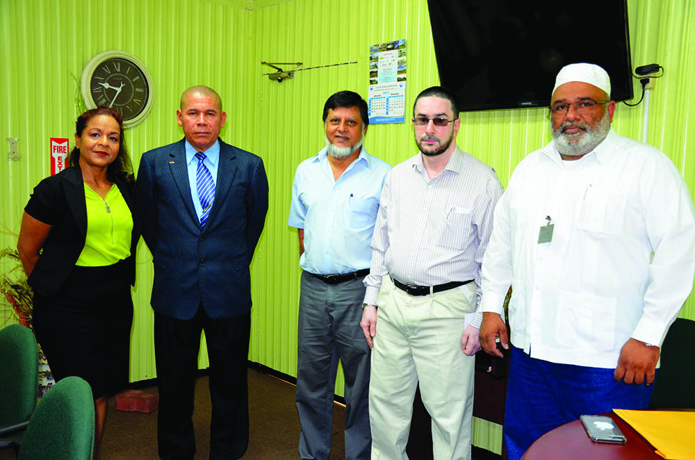 Social Cohesion Minister, Dr George Norton and Technical Officer within the Ministry, Pamela Nauth (left) pose with members of the Central Islamic Organisation of Guyana – Treasurer Raza Ally (centre), Director of Education Shaikh Moeen-ul-Hack and President (ag) Shabudeen Ahmad 