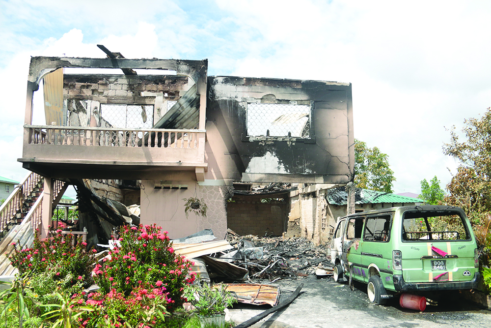 The house and minibus after the blaze 