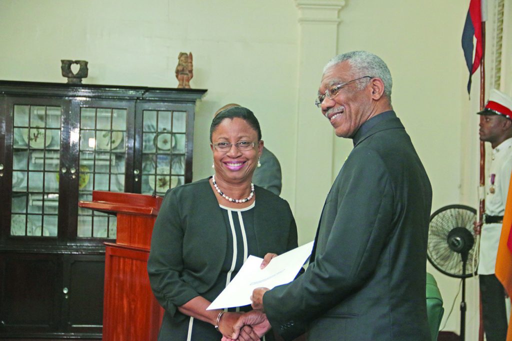 Justice Roxane George receiving her instrument of appointment from President David Granger on Wednesday