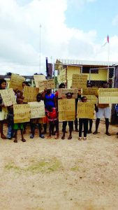 Parents and students protesting the deplorable conditions at the Ituni Primary School